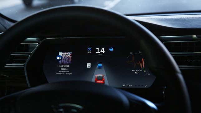 A photo of a Tesla dashboard with Autopilot engaged.